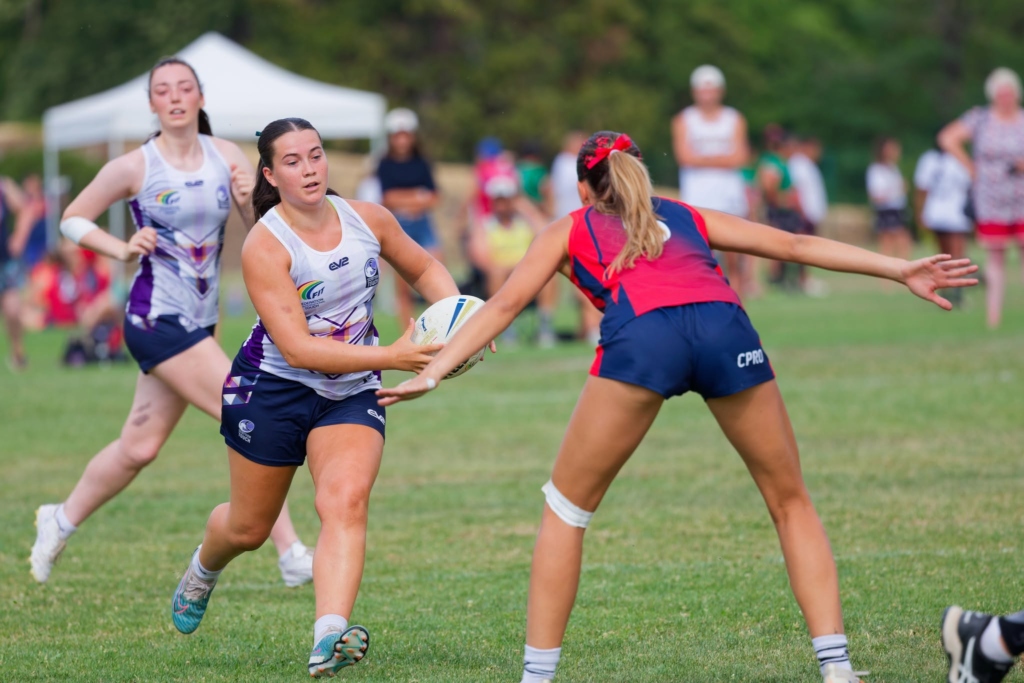 Sarah Hedley passing the ball in a Scotland Touch shirt during a match